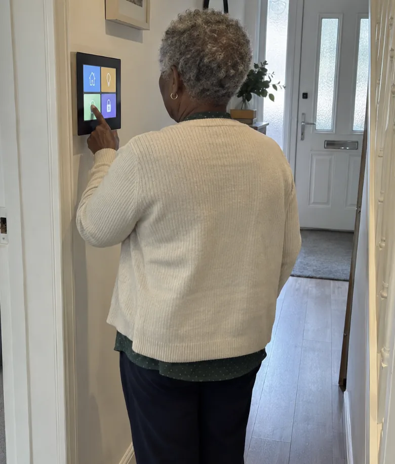 Customer answering a video intercom by the front door