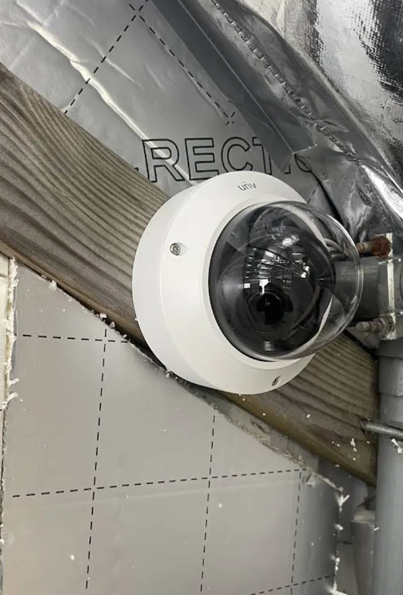External dome camera on a rendered wall