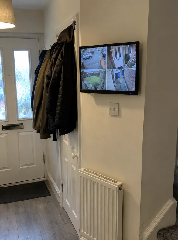 CCTV monitor mounted in a hallway
