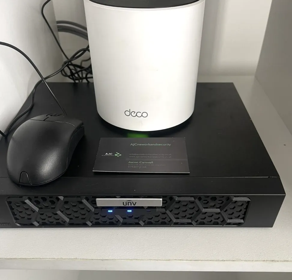 TP Link Deco mesh unit next to a Uniview recorder